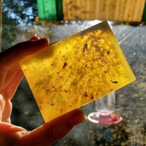 Selling homemade soap with fresh herbs and flowers